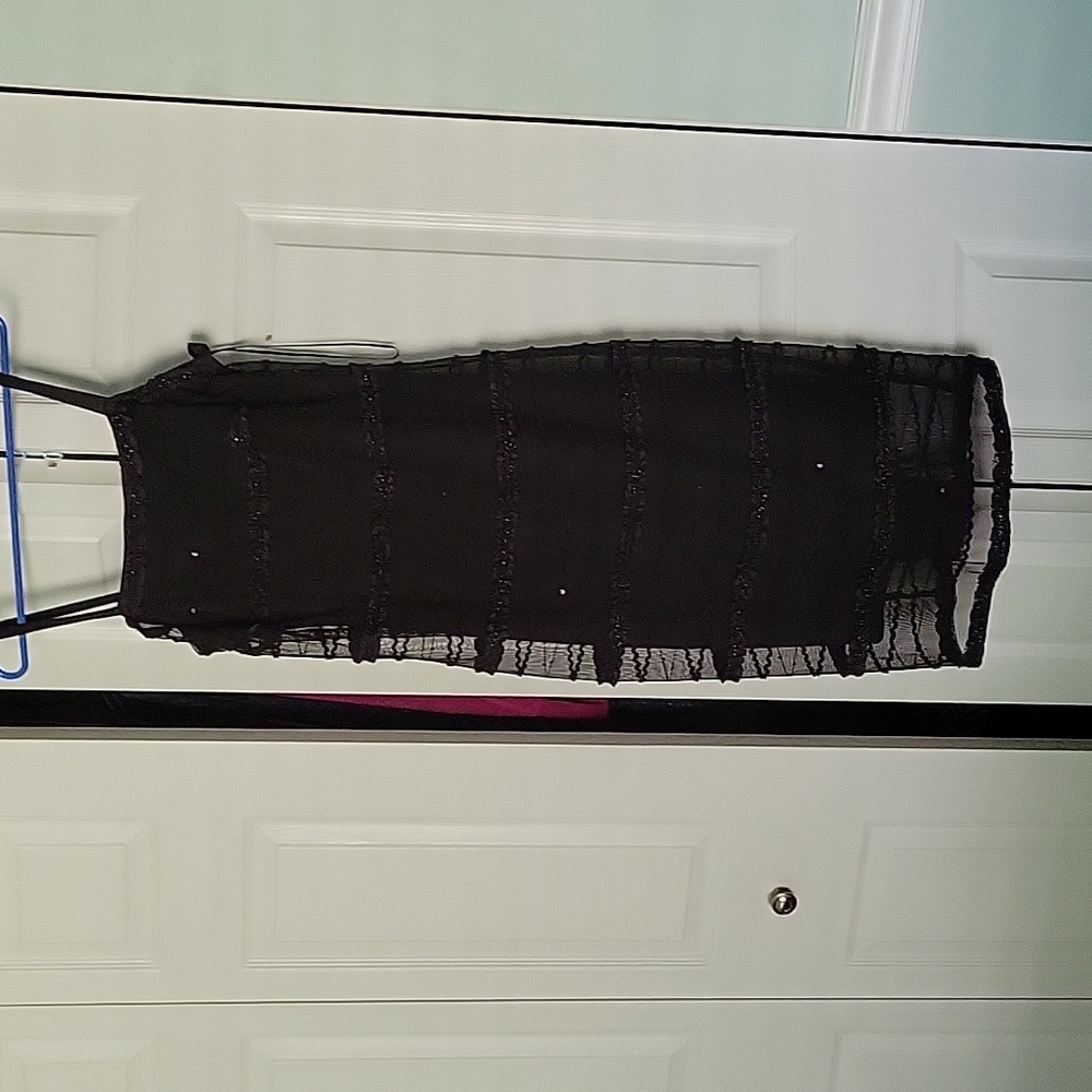 Black dress with srug. Light sequin. Only worn once for a wedding.